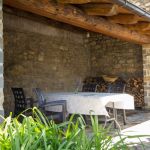 Covered porch great for outdoor dining.